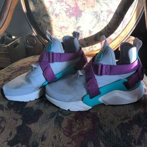 purple, turquoise, and gray Nike shoes